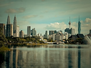 a large body of water with a city in the background