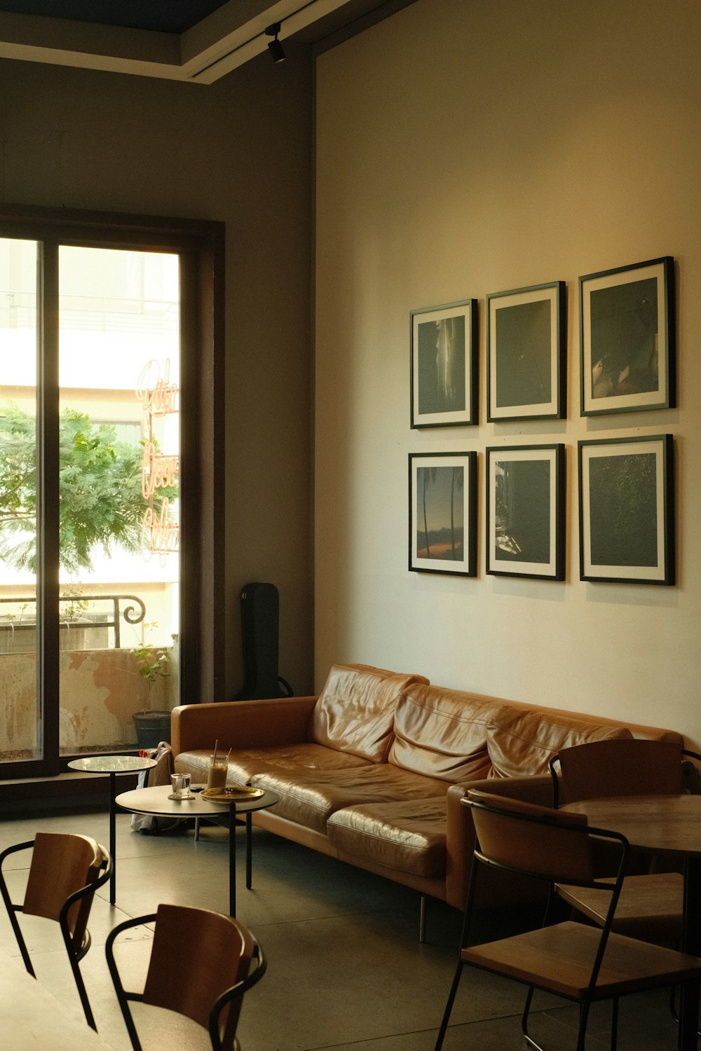 a living room filled with furniture and a window