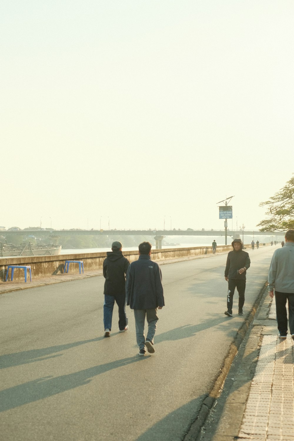 a group of people walking down a street