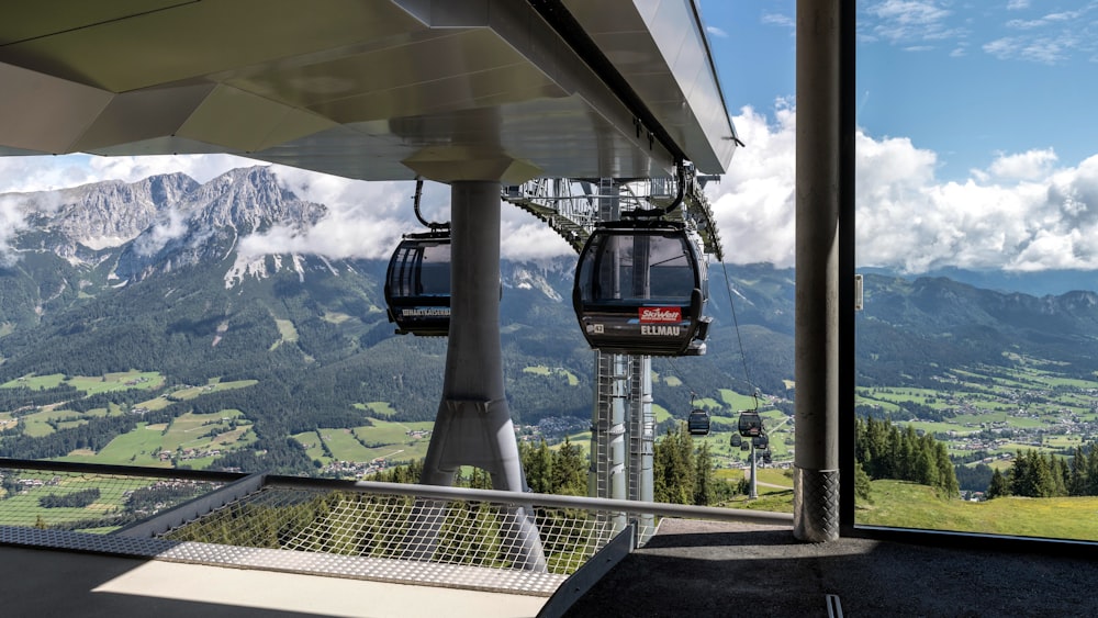 a gondola with a view of a mountain range