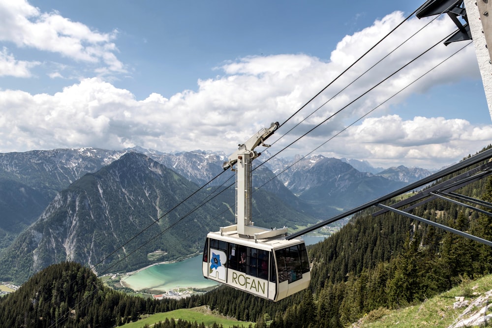 a gondola with a view of a lake and mountains