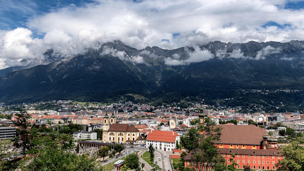 a view of a city with mountains in the background