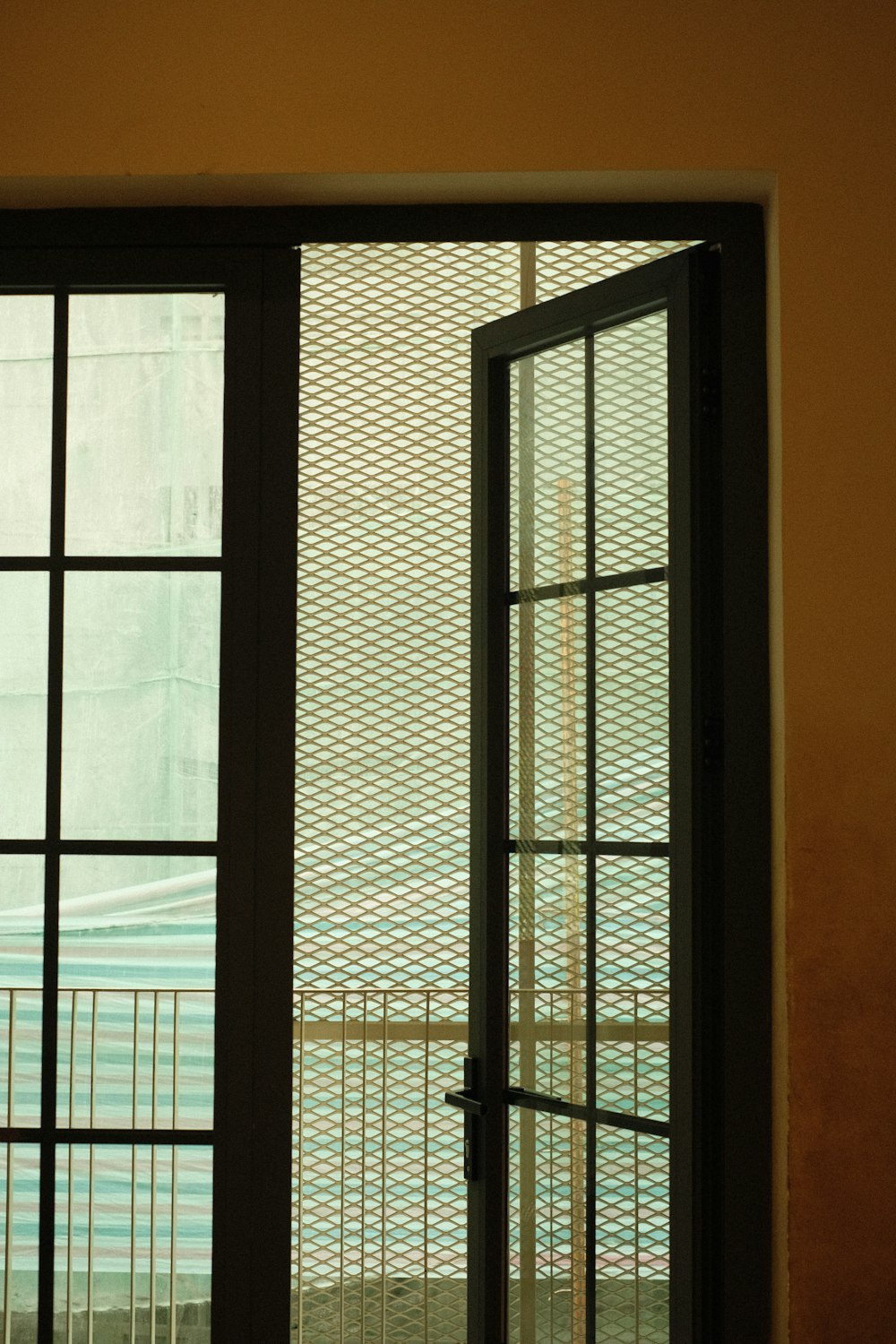 an open window with a view of a pool