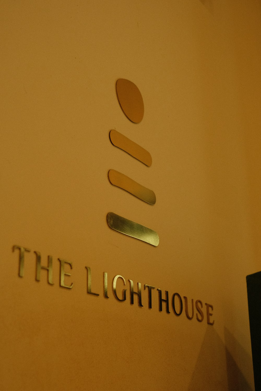the sign for the lighthouse on the wall