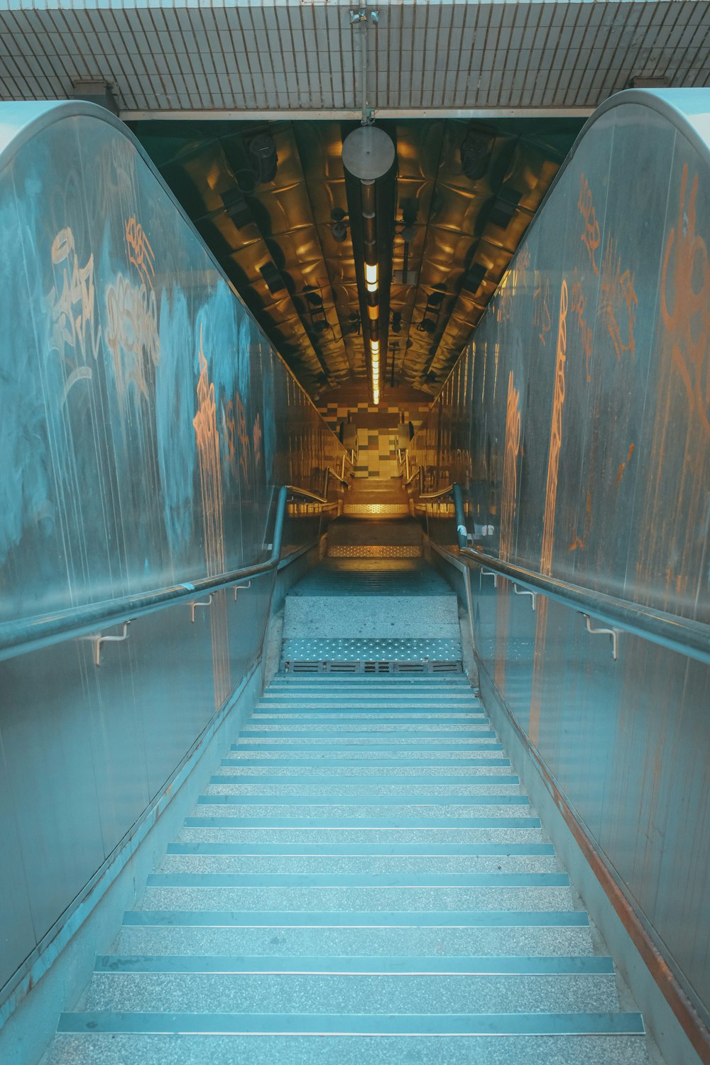 a set of stairs leading up to a tunnel