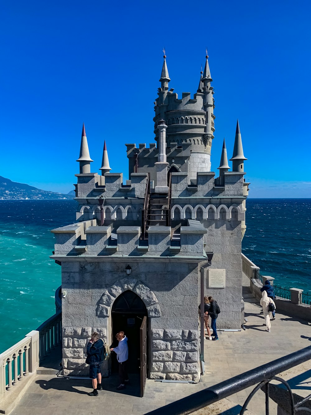 a castle built into the side of a body of water