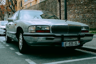 a silver car parked on the side of the road