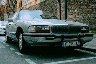 a silver car parked on the side of the road