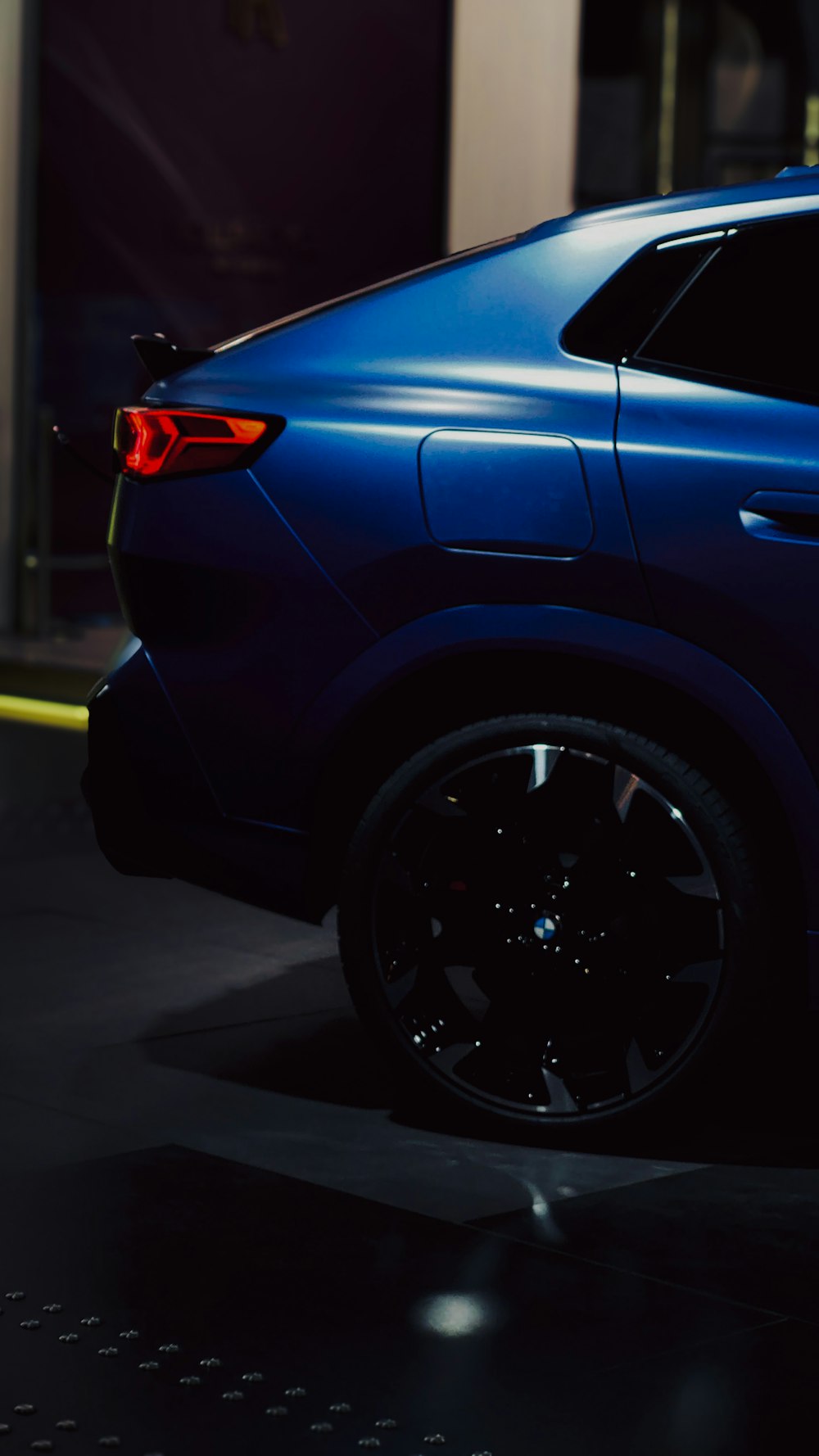 a blue suv parked in a parking lot