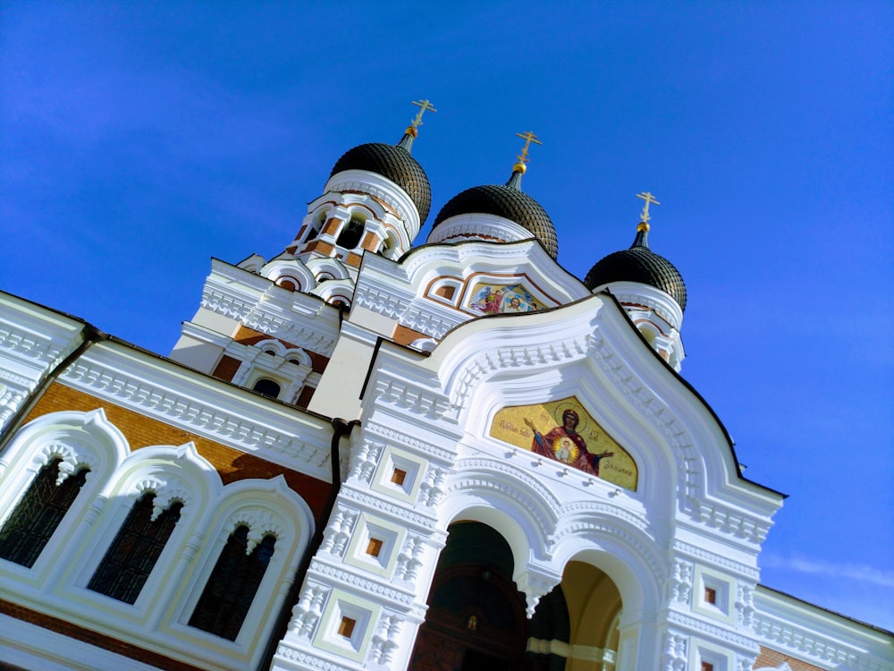 a large white church with a cross on it's side