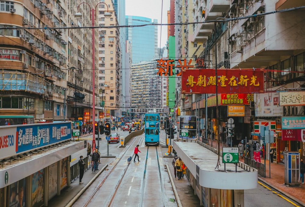 a city street filled with lots of tall buildings