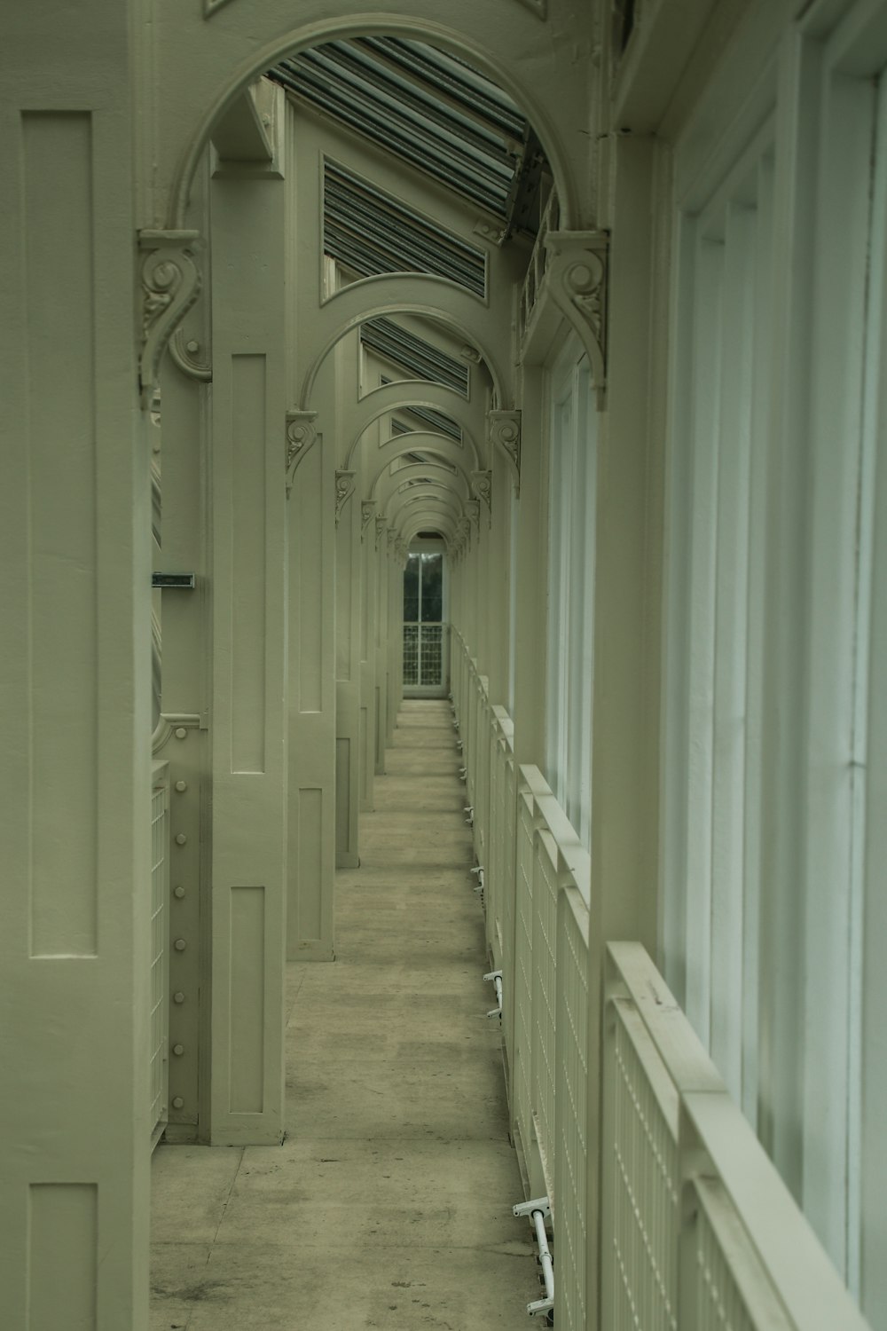 a long hallway with a clock on the wall