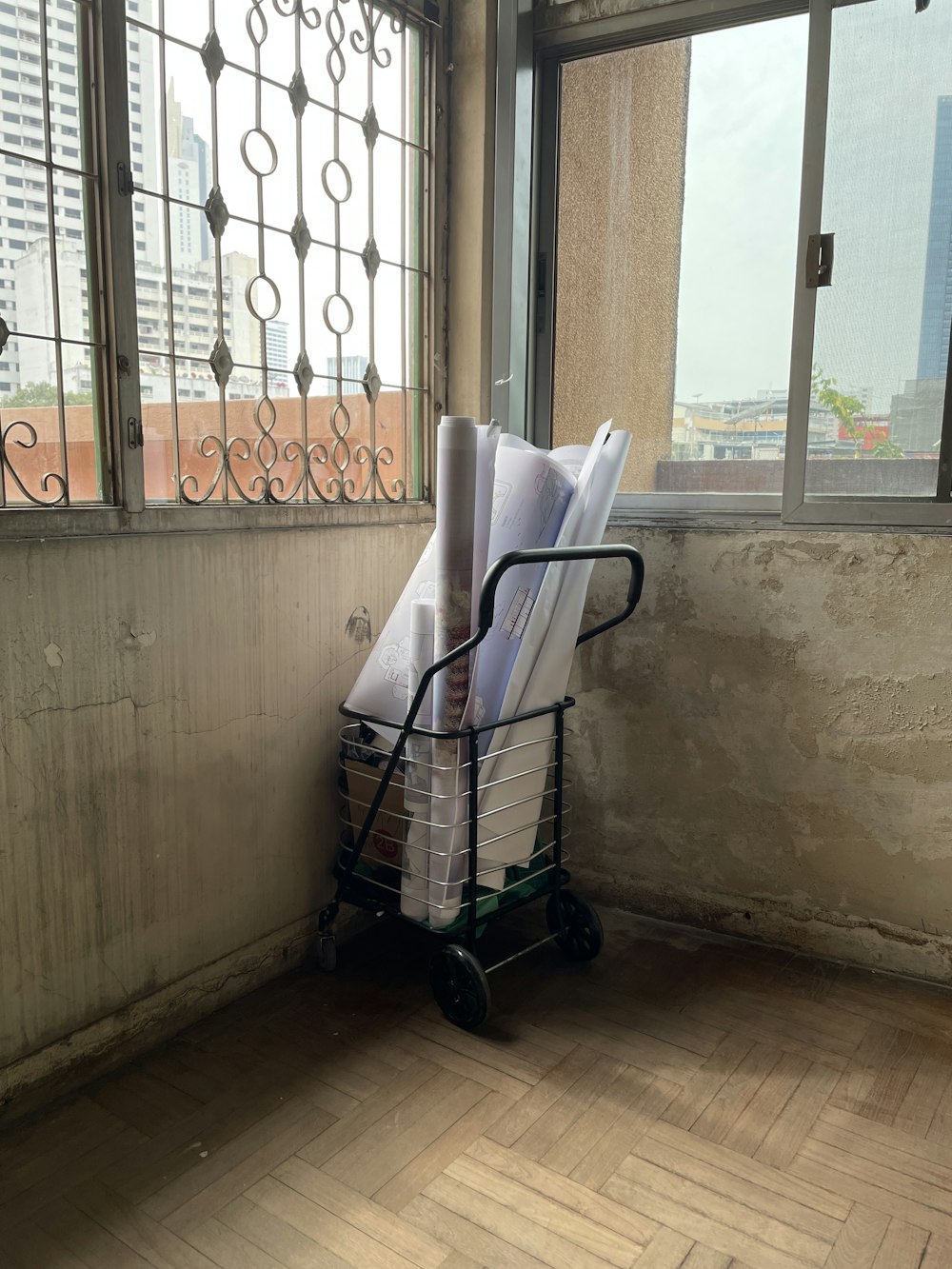 a cart full of papers sitting next to a window