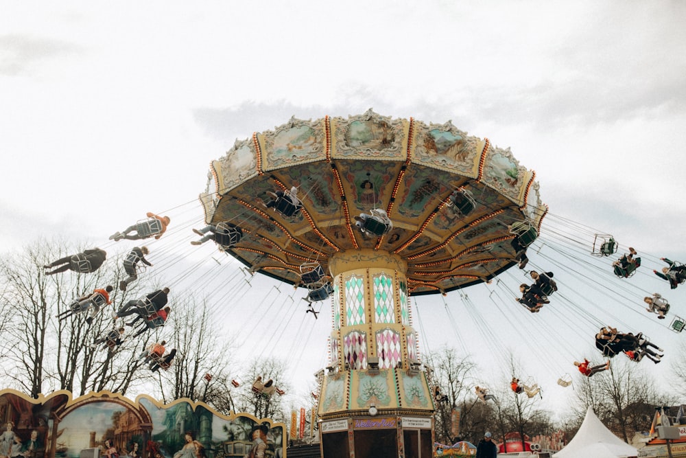 a carnival ride with people riding on it