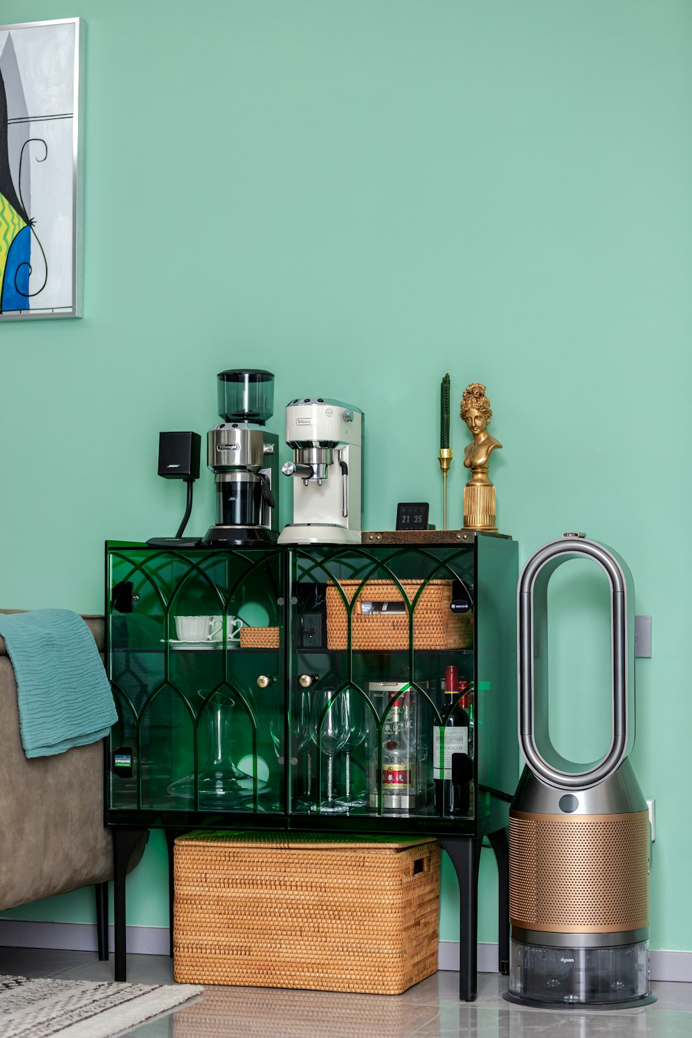 a living room with a green wall and furniture