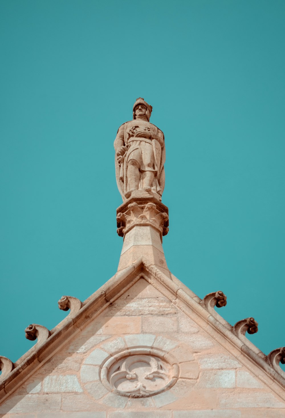 a statue of a man on top of a building