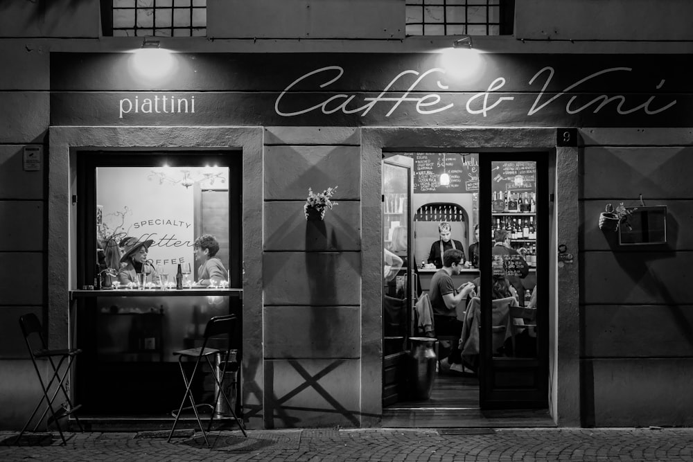 a black and white photo of a coffee shop