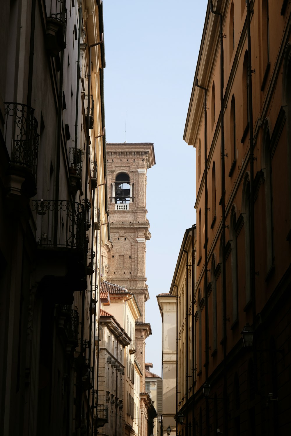 a tall clock tower towering over a city street