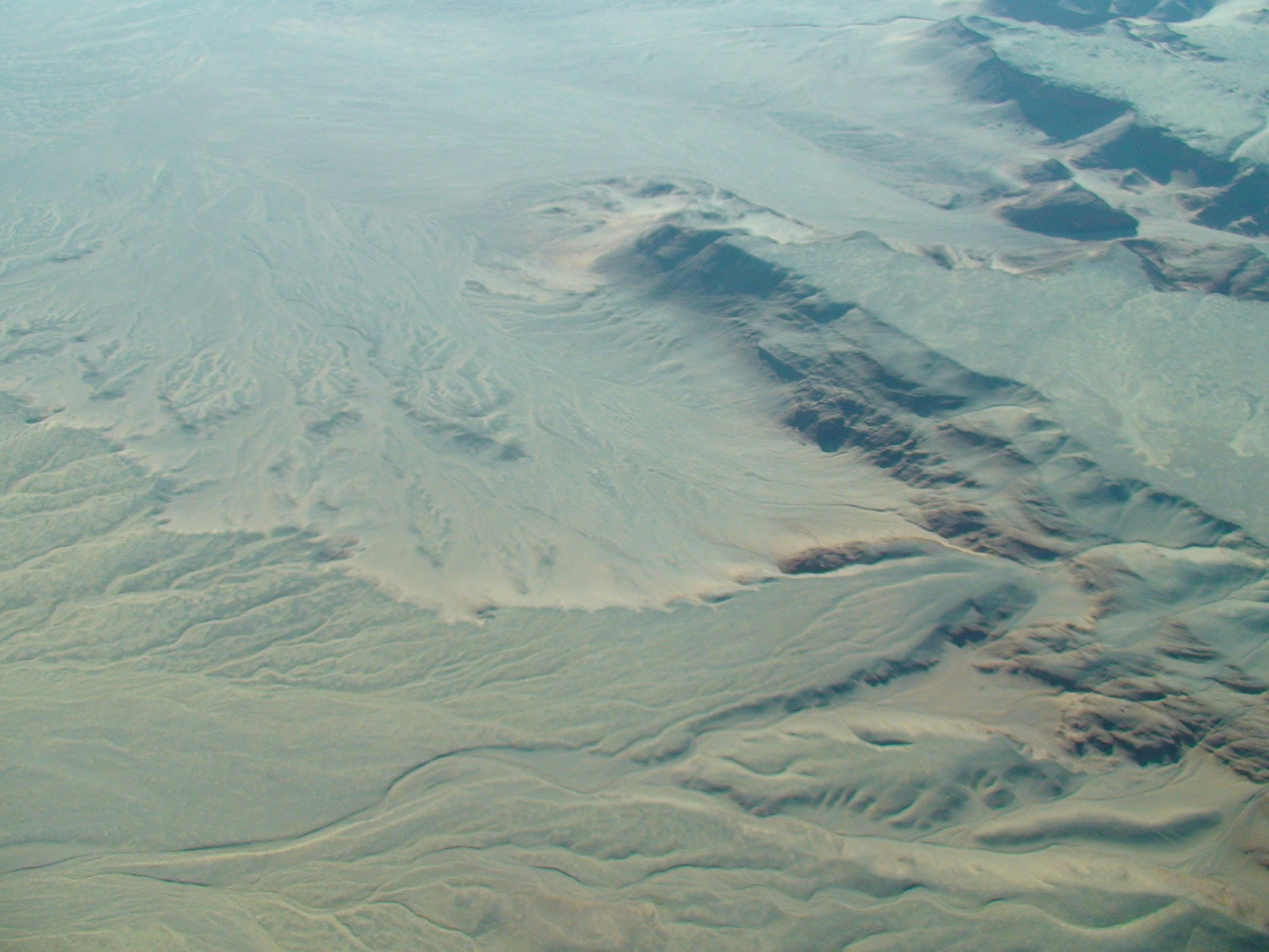 an aerial view of a mountain range in the desert