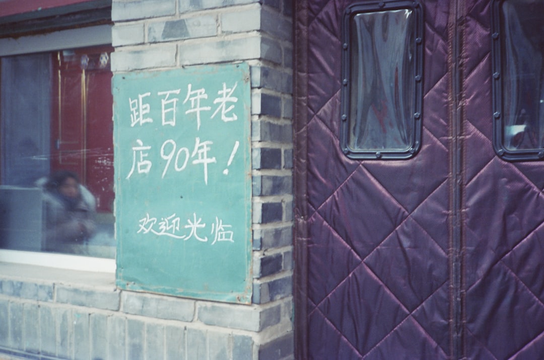 a brick building with a sign on the side of it,
