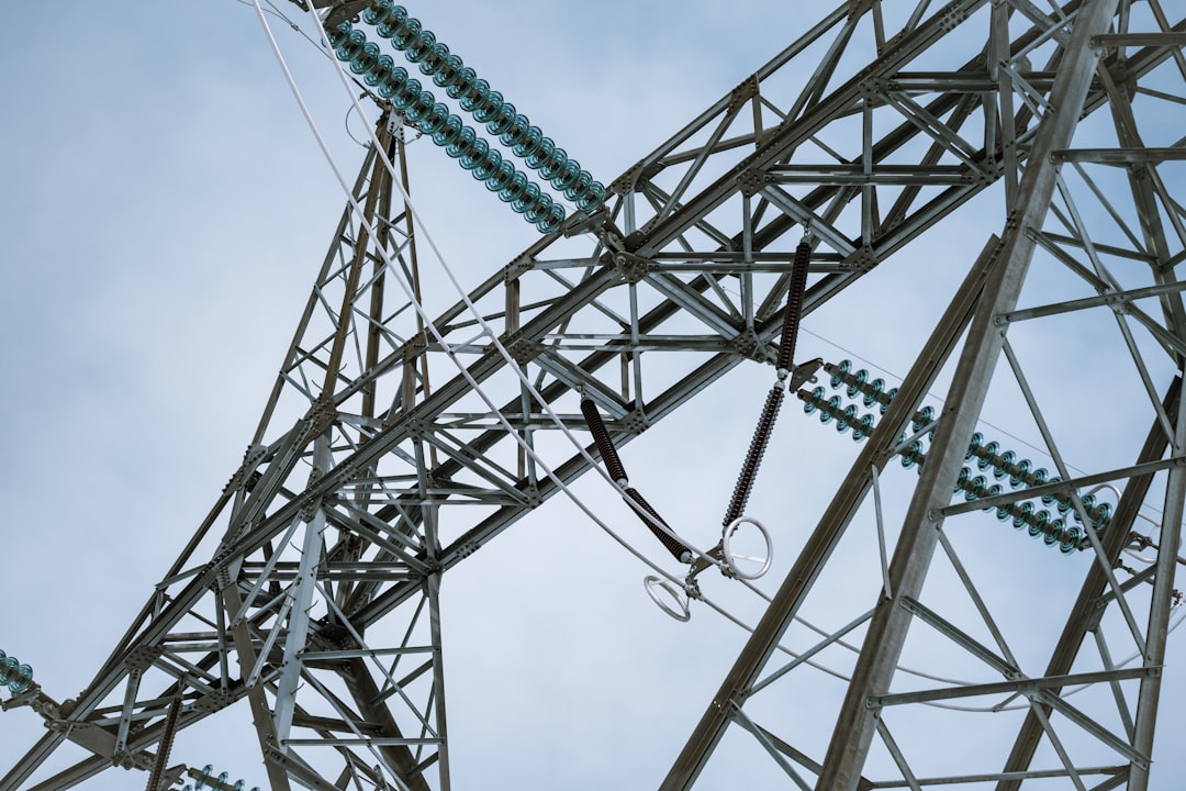a close up of a metal structure with a sky in the background, Norwegian power lines