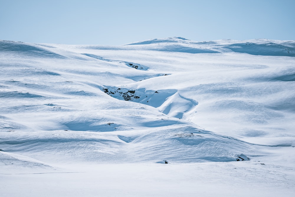 a person skiing down a snow covered mountain