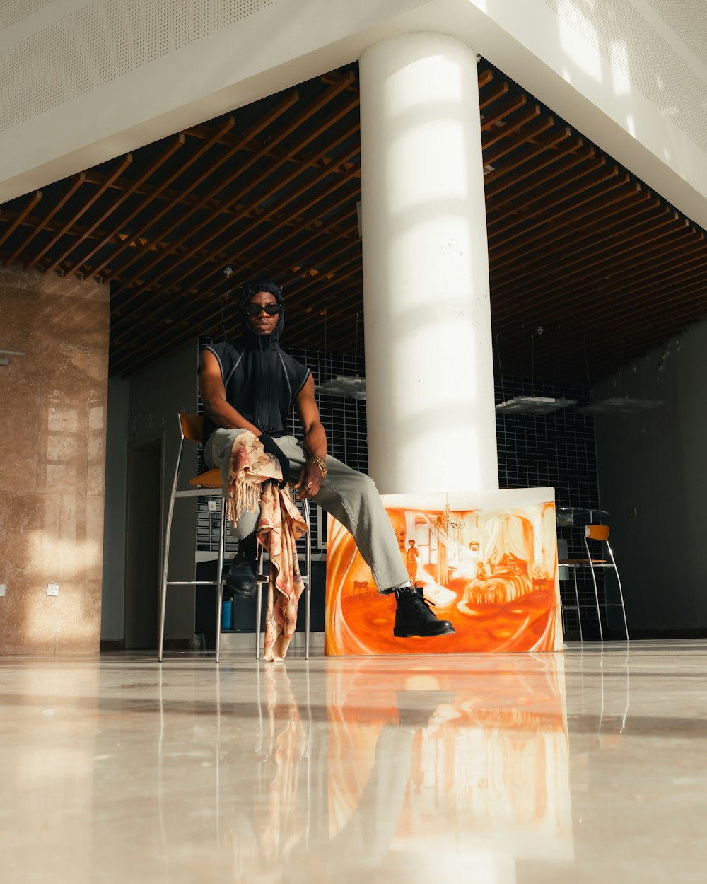 a man sitting on a chair in a room