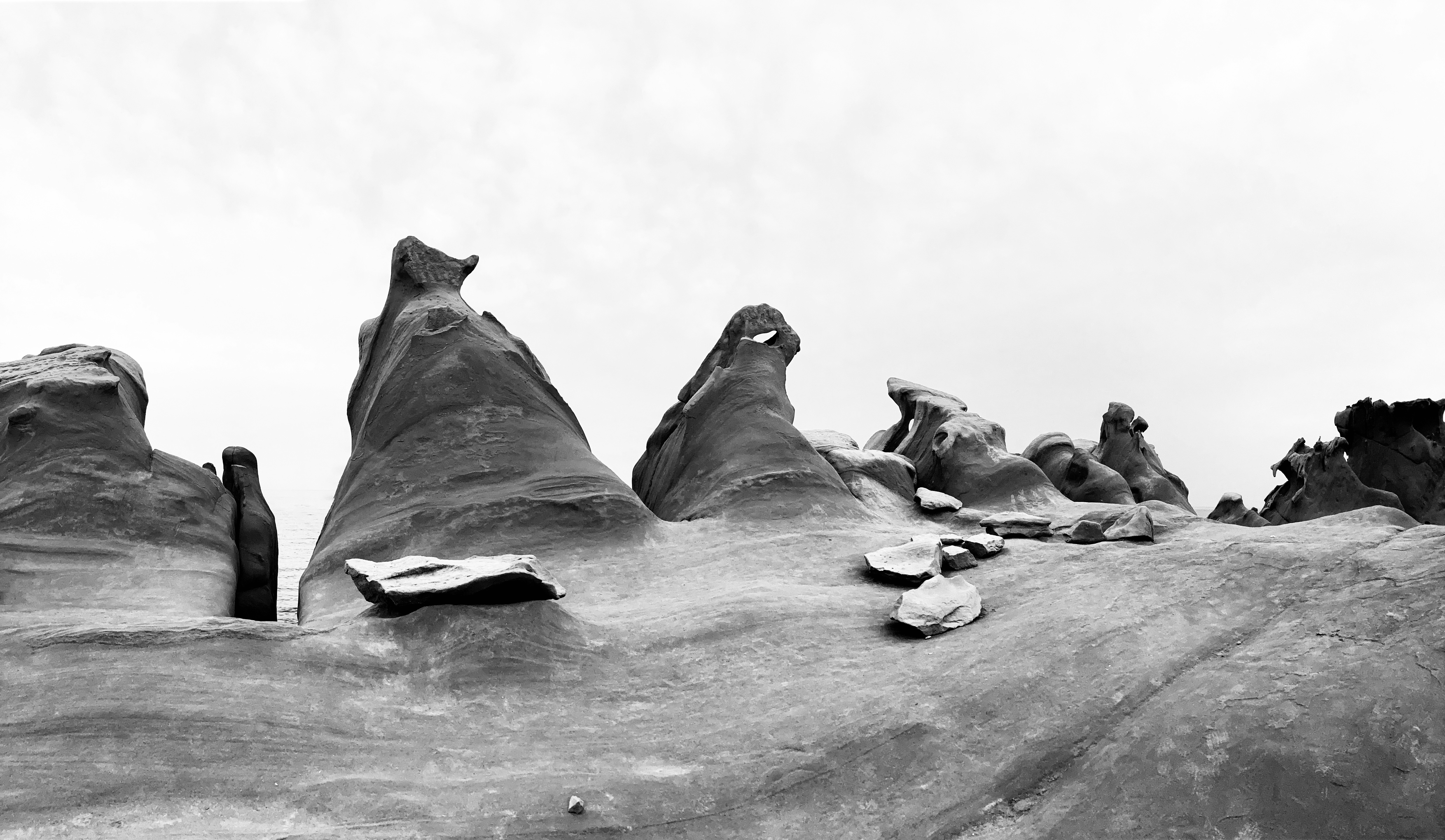 a black and white photo of a rock formation