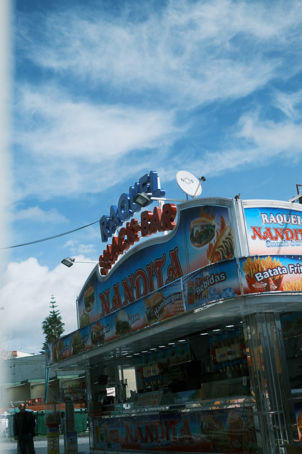 a food truck is parked on the side of the road