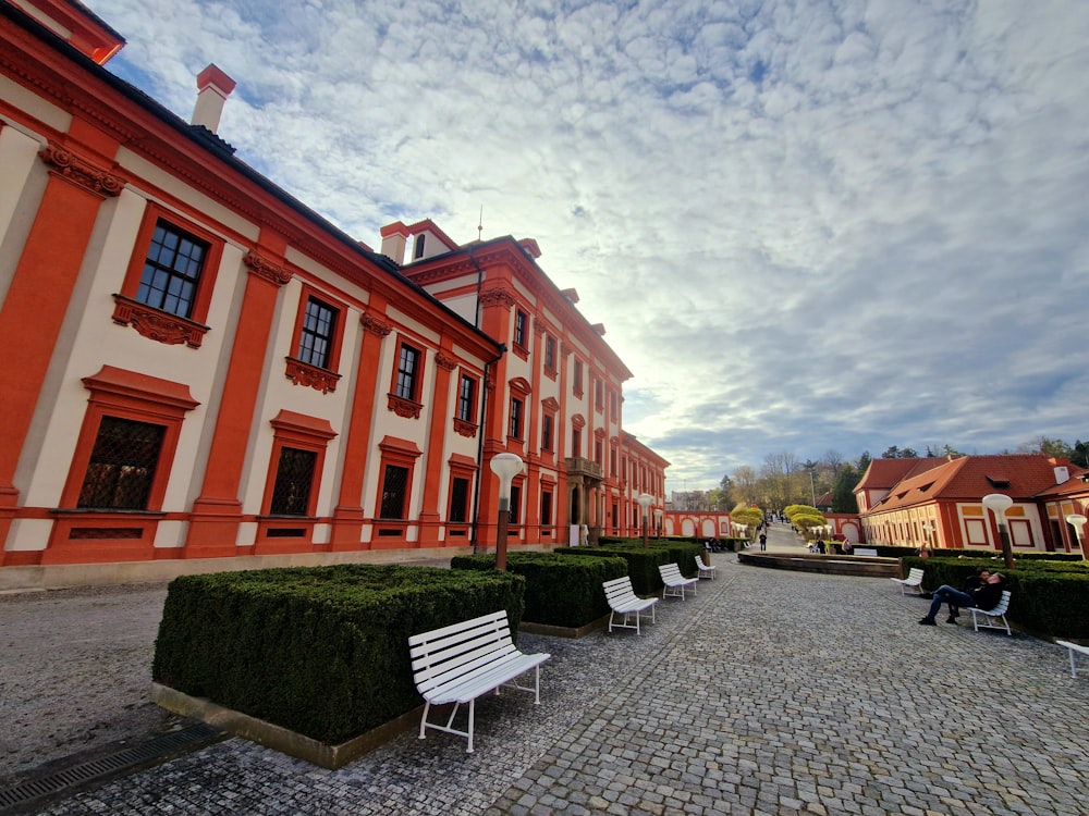 a couple of benches sitting in front of a building