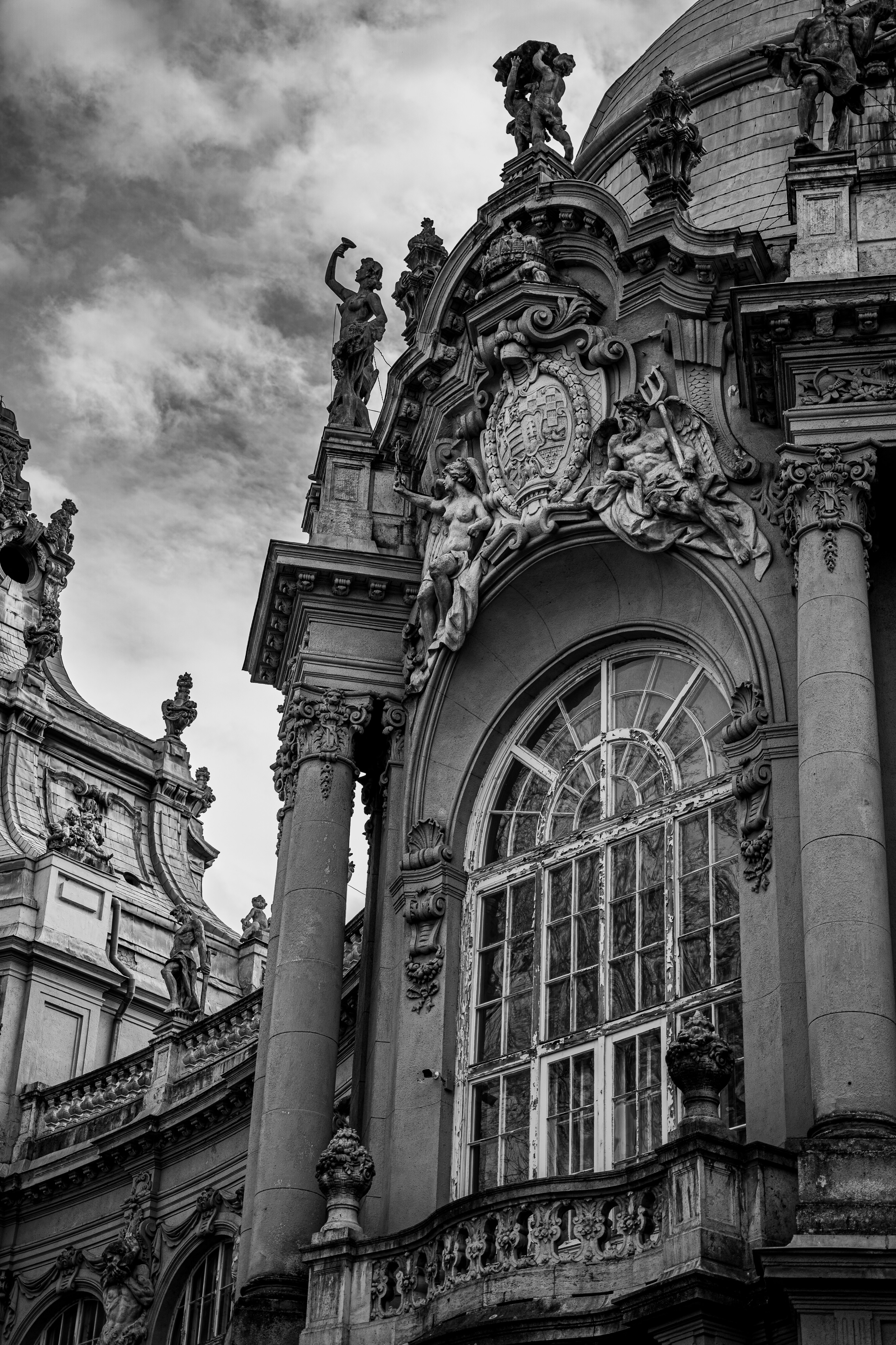 a black and white photo of a building with a clock