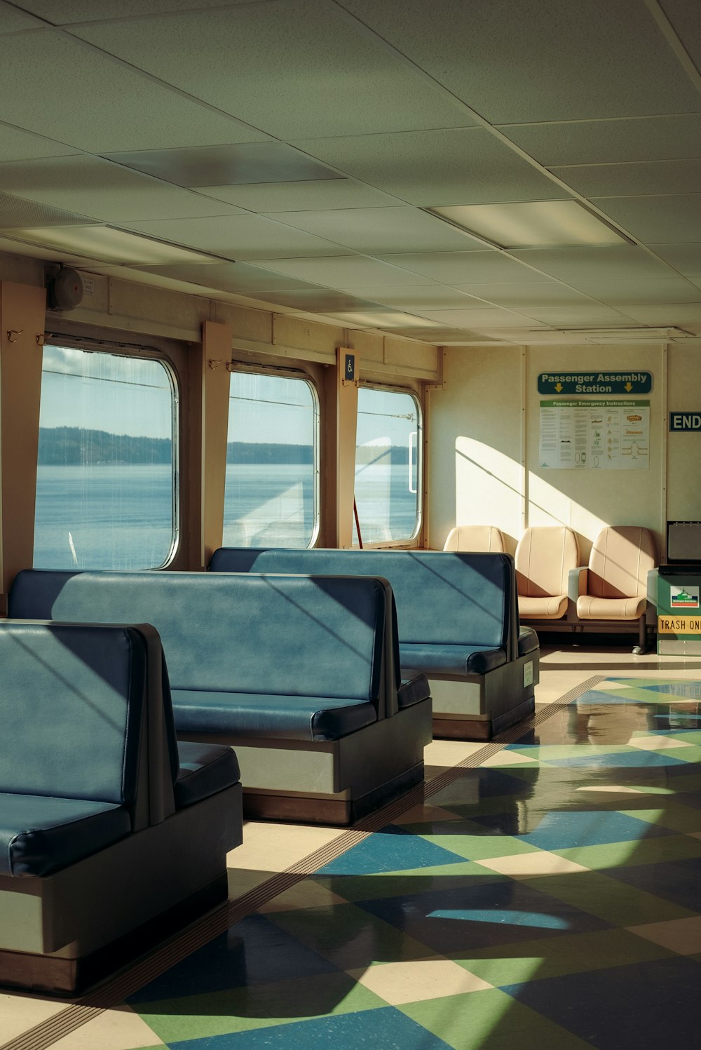 a row of seats sitting on top of a train next to a window