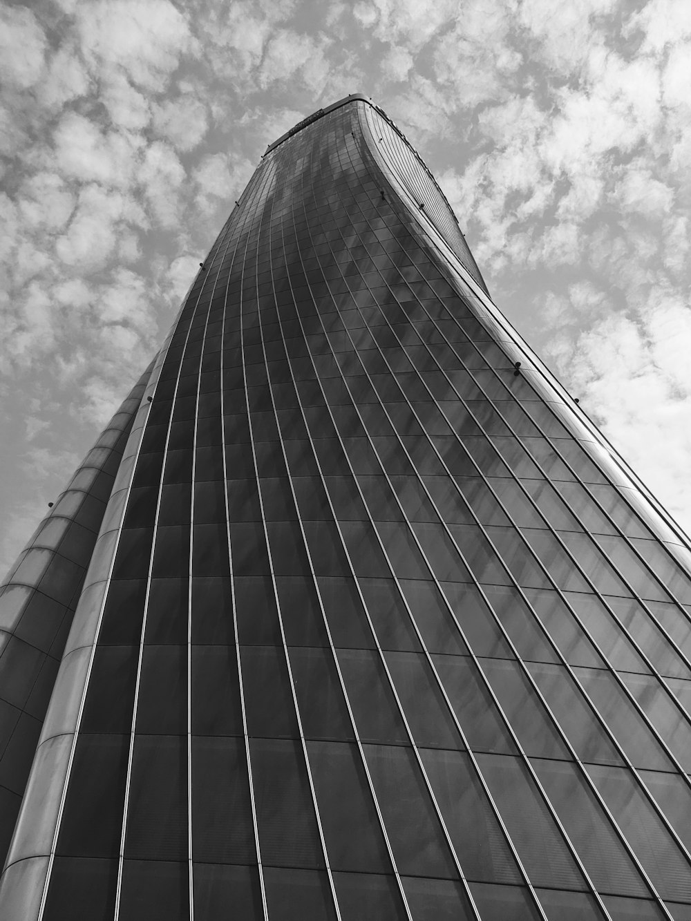 a black and white photo of a tall building