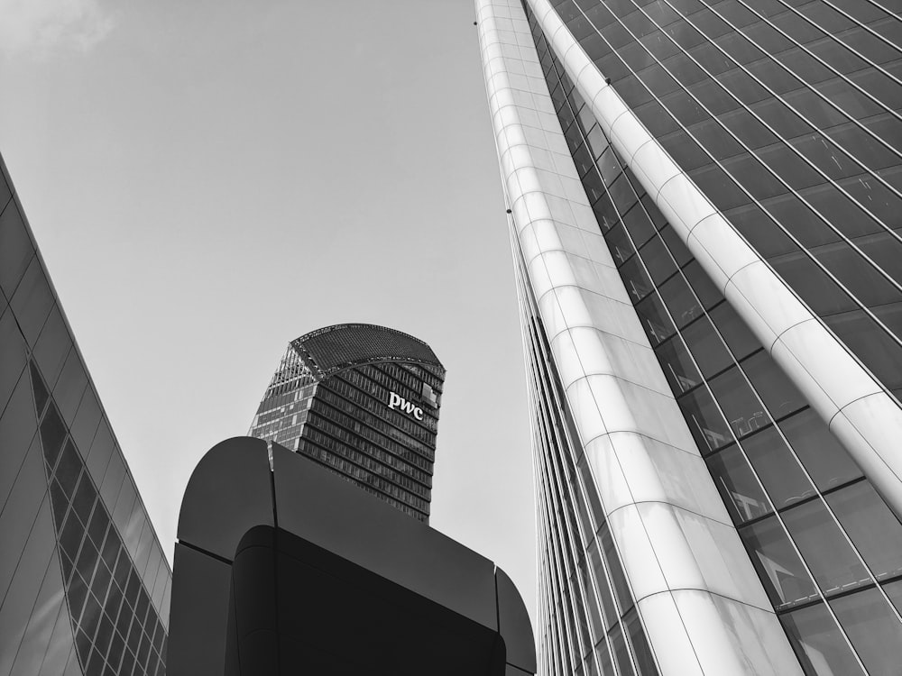 a black and white photo of two tall buildings