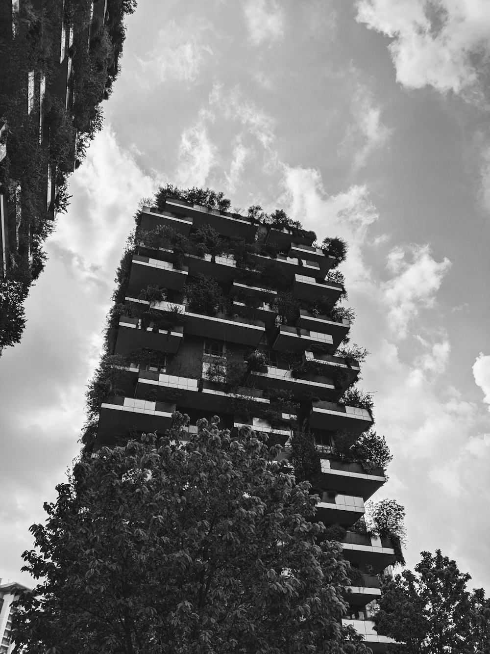 a very tall building with many balconies on it