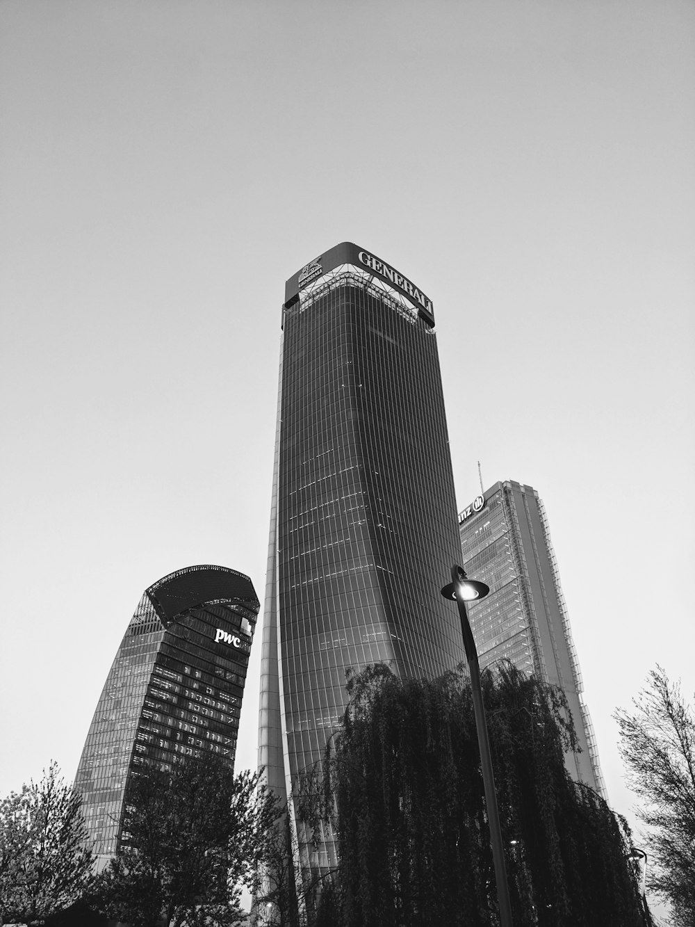 a black and white photo of two tall buildings