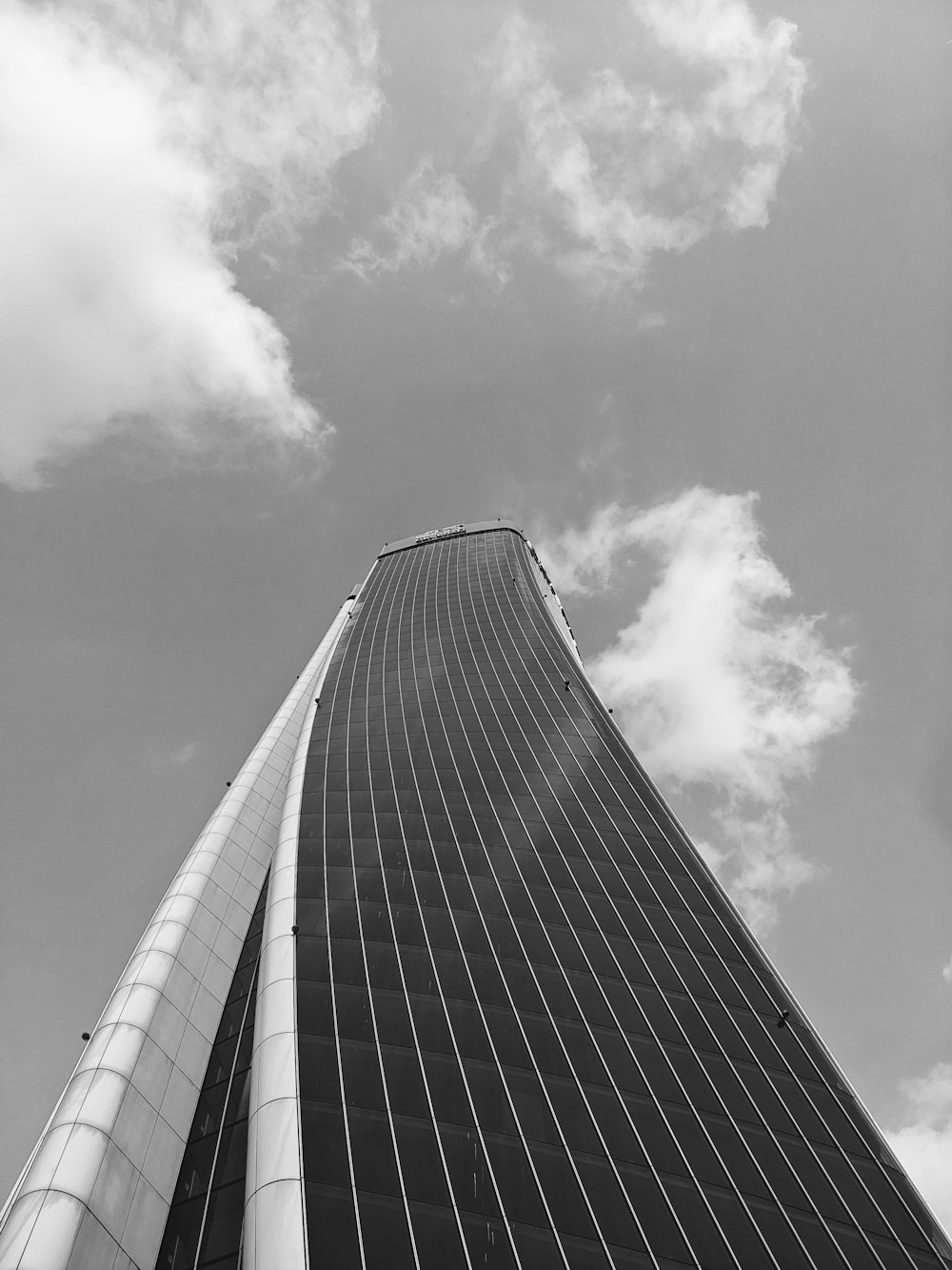 a very tall building with a sky background