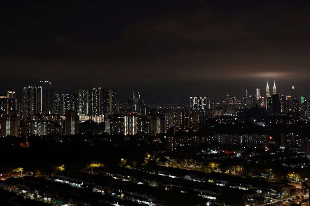 a night view of a city with a lot of tall buildings