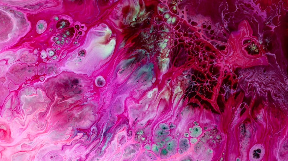an abstract painting with pink and green colors