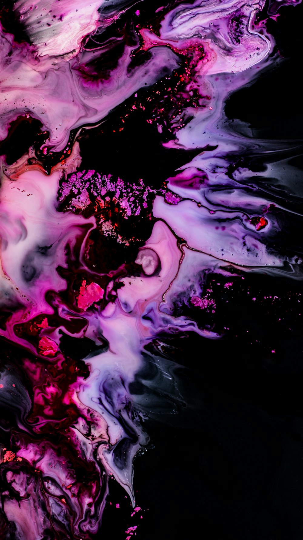 a close up of a black and purple liquid