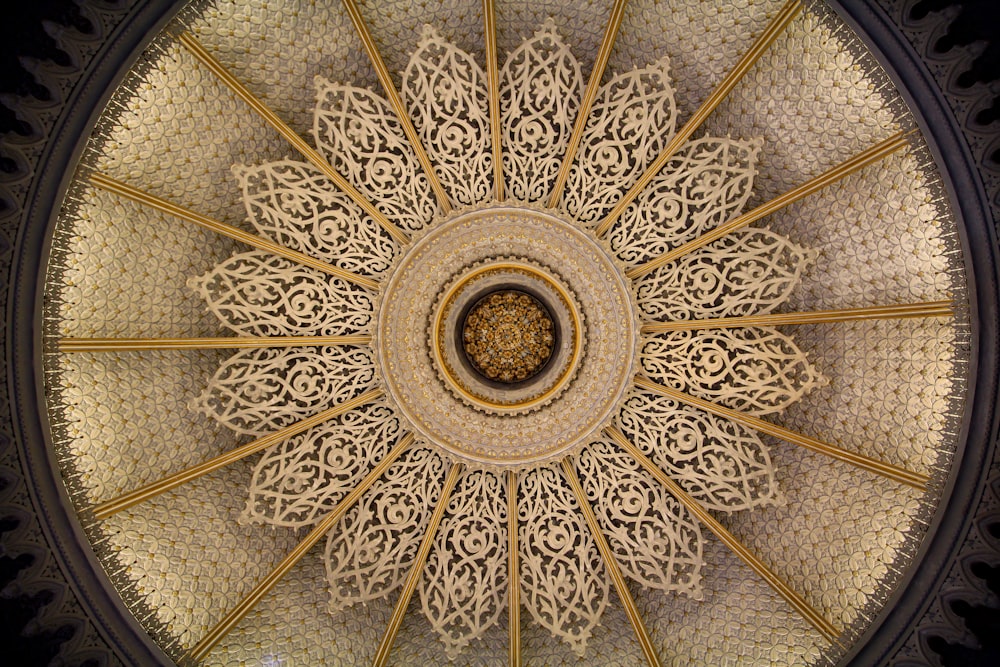 the ceiling of a building with intricate designs