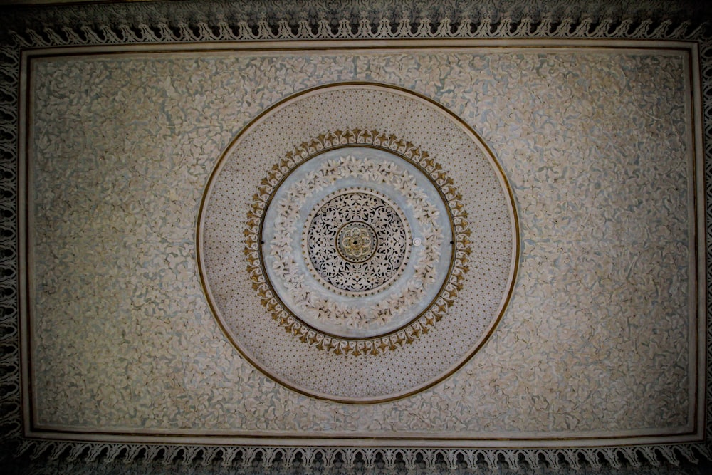 a ceiling with a circular design on it