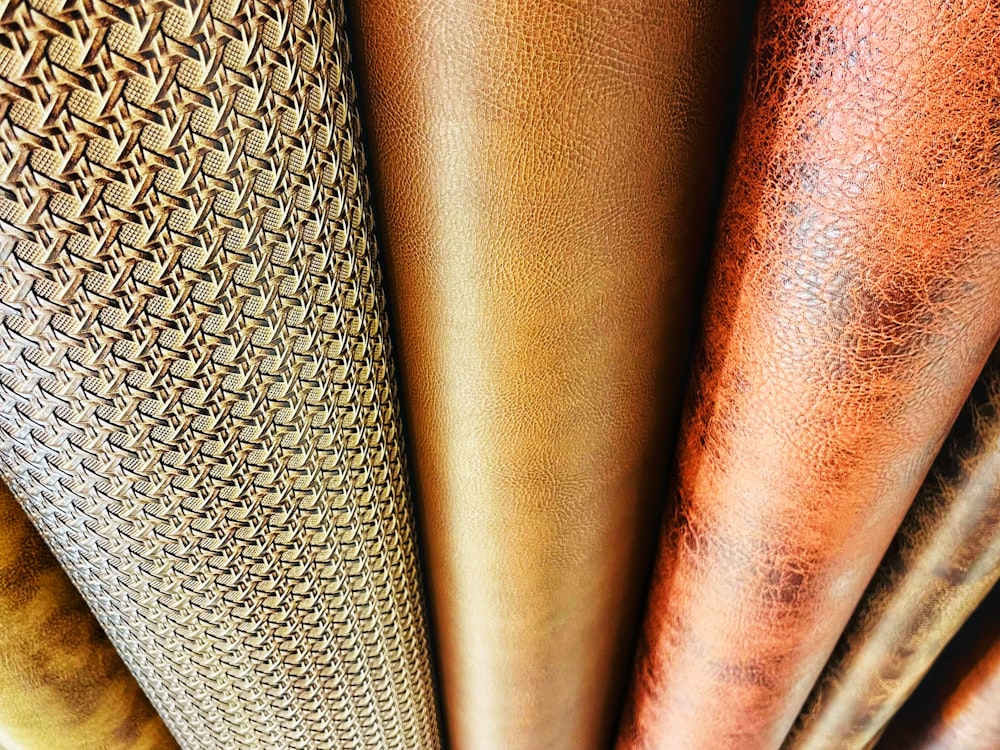 a close up of a bunch of different colored leathers