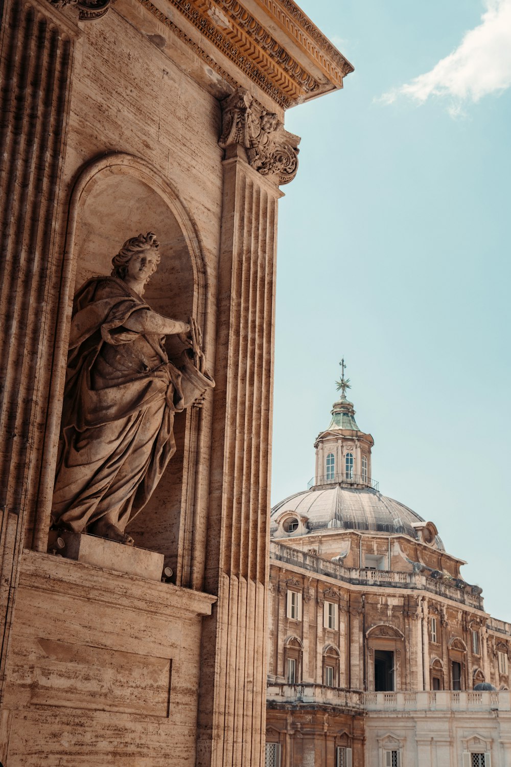 a statue of a woman in front of a building