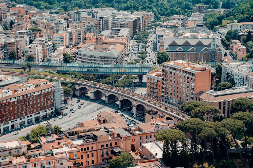 an aerial view of a city with a bridge