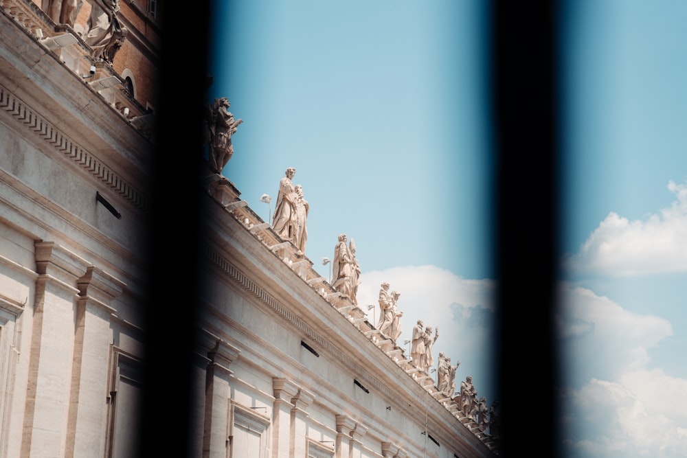 a building with statues on top of it