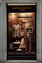 a window display of a man's suit and tie