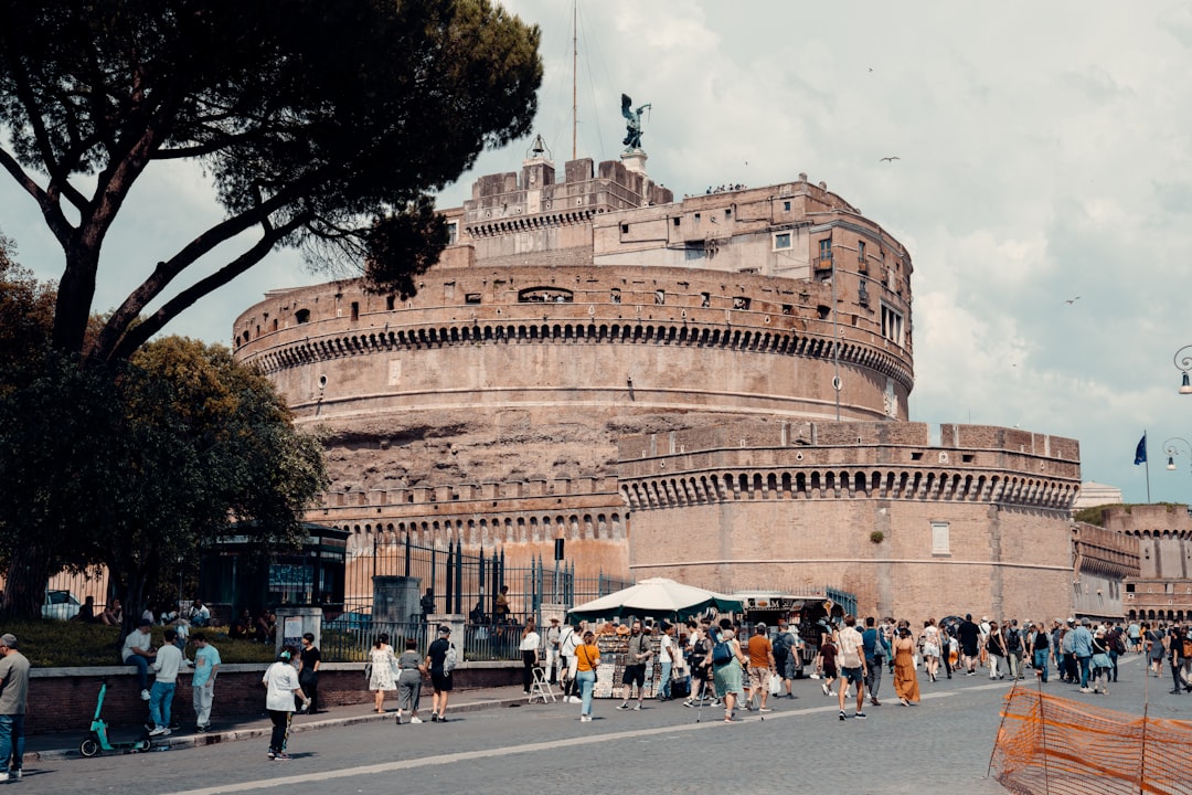 a crowd of people walking around a large building, Nearly every street in Rome has a building that dates hundreds of yea