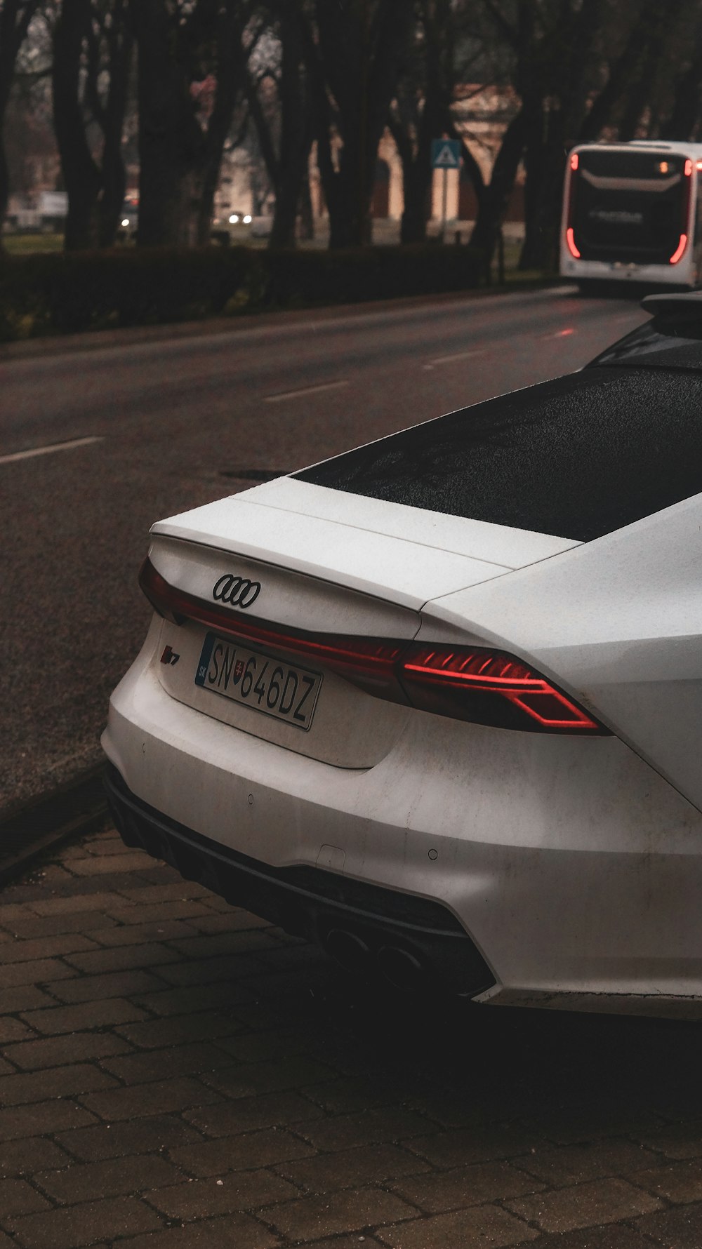 a white car parked on the side of the road