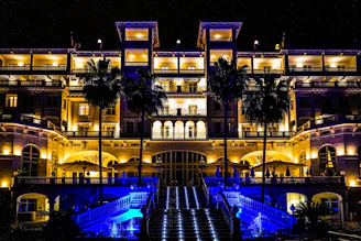 a large building lit up with blue lights